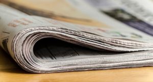 Folded Newspaper with Obituaries